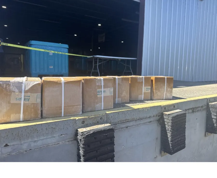 Cardboard boxes at a loading dock before a business delivery